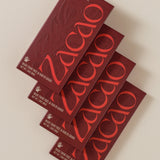 Four Zacao 70% Dark Chocolate bars arranged in a row, showcasing packaging and brand logo.